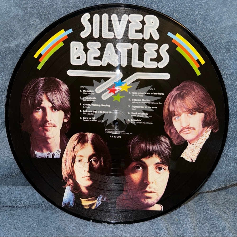 A 1982 Silver Beatles Vinyl Record LP Album, perfect for any music collector.